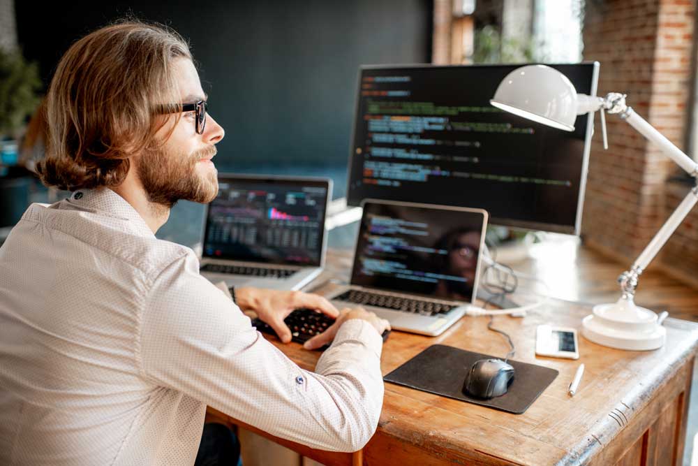 man working in home office technology
